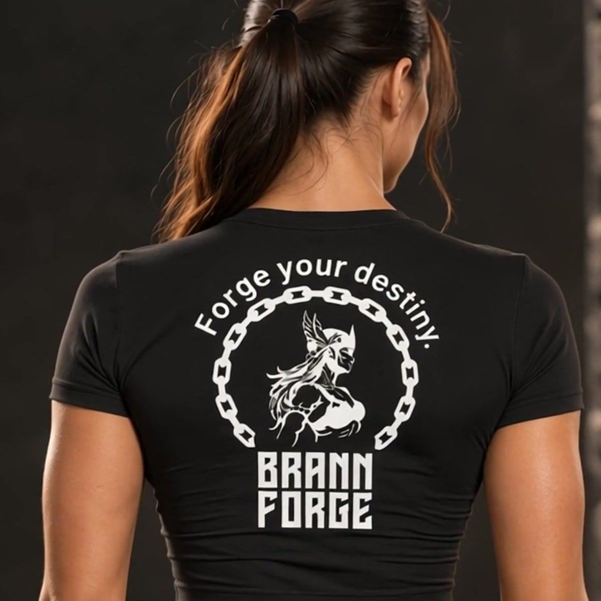 Back print of the Black ForgeForm Tee in a gym